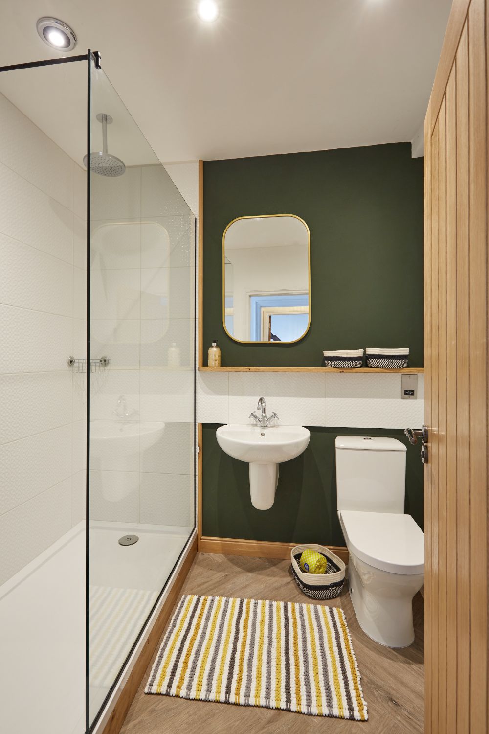 The bathroom with walk-in shower