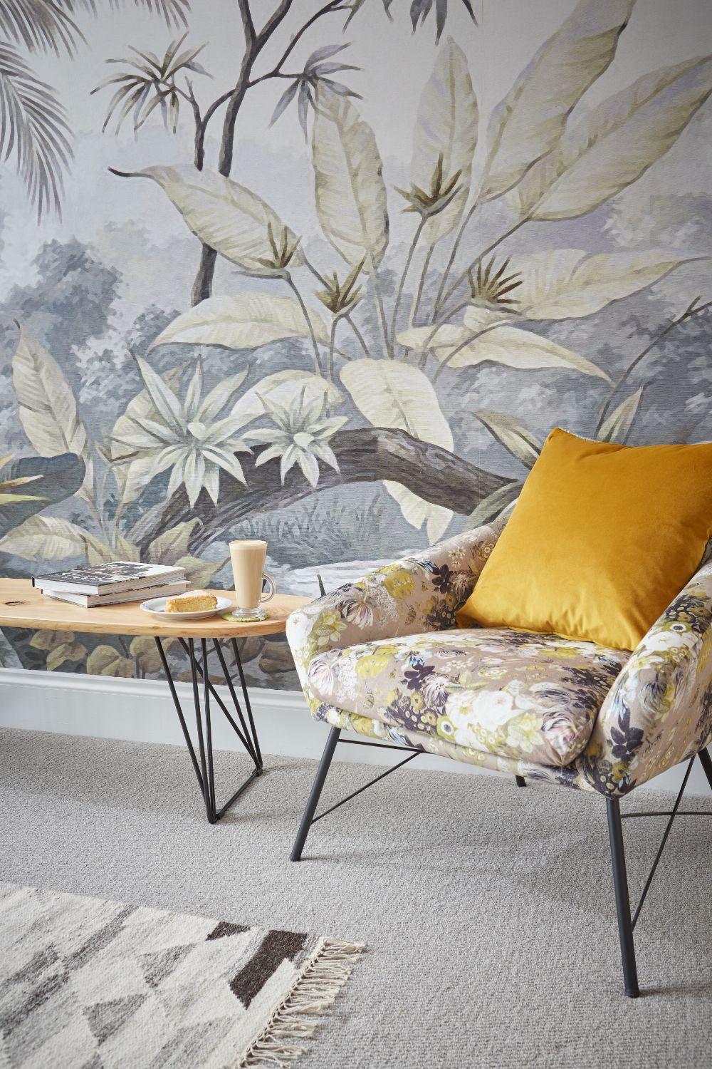 A chic chair in front of the feature wall in the living area