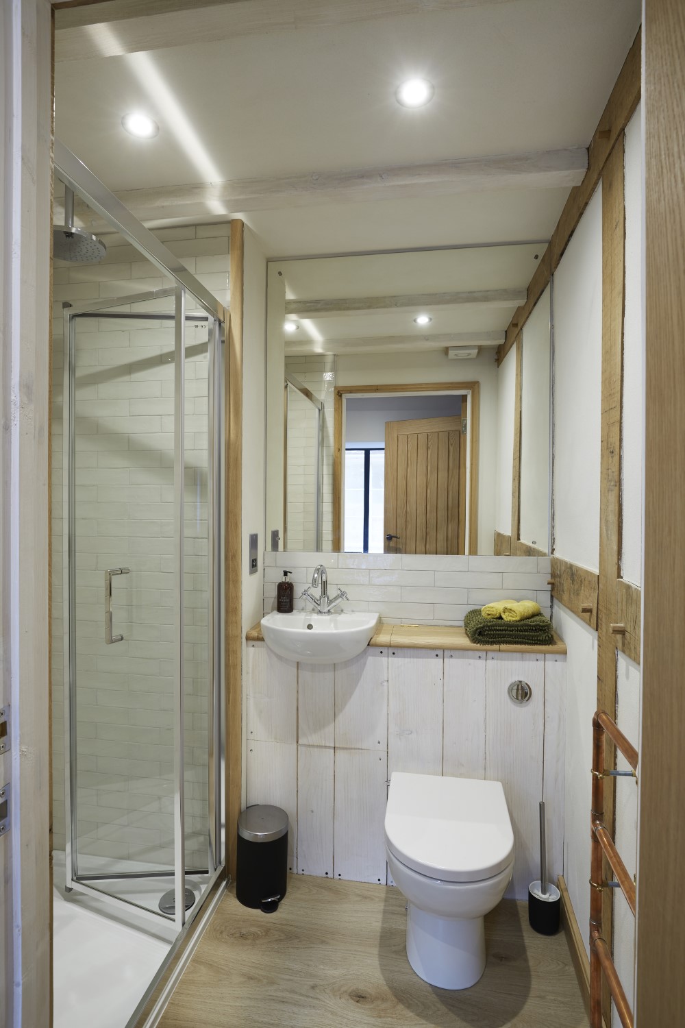 The separate bathroom with shower, toilet and sink